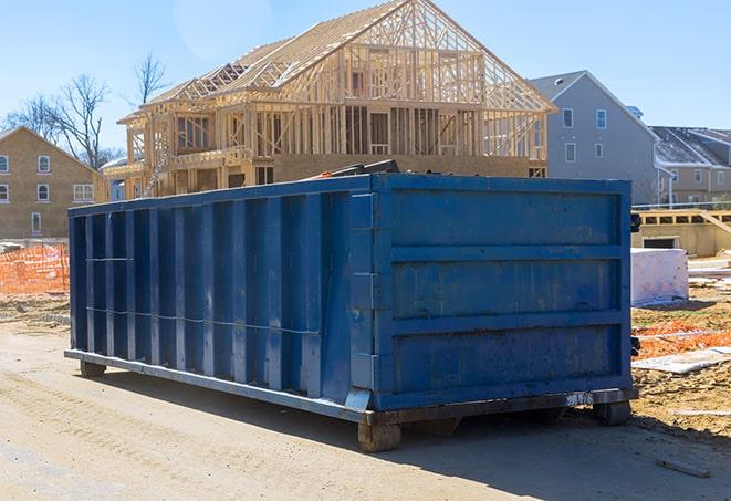 a residential dumpster fleet ready to be rolled out for a community cleanup event